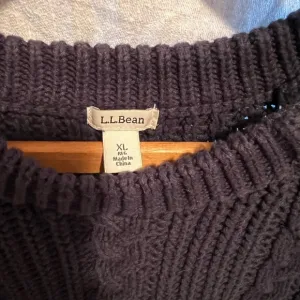L.L.Bean vintage cable knit navy sweater. Size XL. Button accents on shoulder.